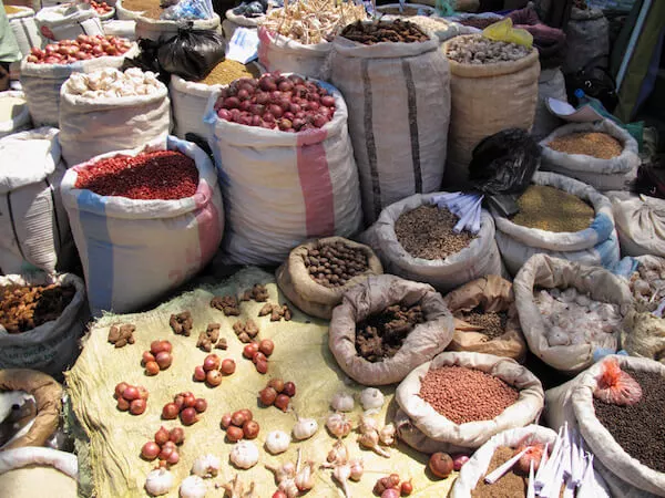 Comoros Facts: Spices sold in the market - image by AltrendoImages/shutterstock.com